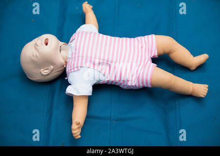 Mannequin child for first aid training. Training dummy kid for practicing artificial respiration Stock Photo