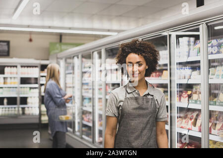 Portrait of grocery store sales assistant Stock Photo