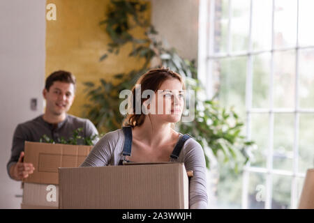 Couple moving into a new home Stock Photo