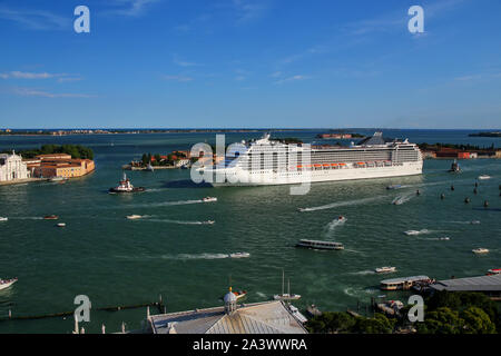 Cruise ship moving through San Marco canal in Venice, Italy. Venice is situated across a group of 117 small islands that are separated by canals and l Stock Photo