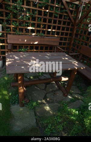 wooden bench in the garden Stock Photo