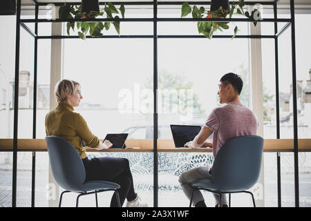 Freelancers working in a cafe Stock Photo