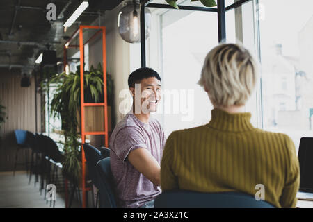 Friends having coffee together in a cafe Stock Photo