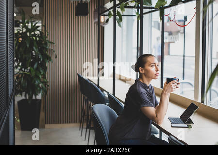 Freelance businesswoman working in a cafe Stock Photo