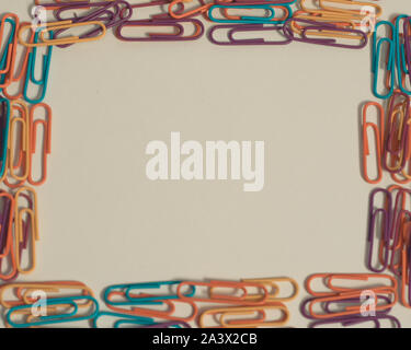 Frame made with multi-colored clips on white isolated background, to fill Stock Photo