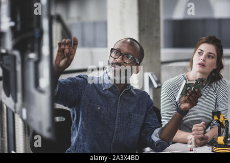 Teacher in a robotics engineering class Stock Photo