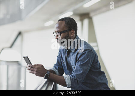 African american businessman using smartphone Stock Photo