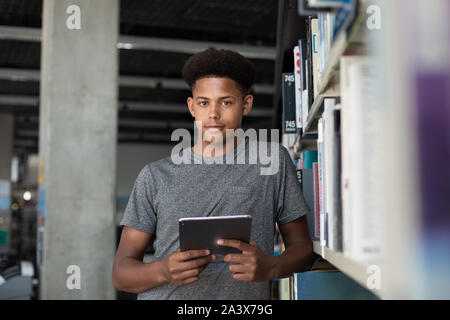 Portrait of african american male student in library Stock Photo