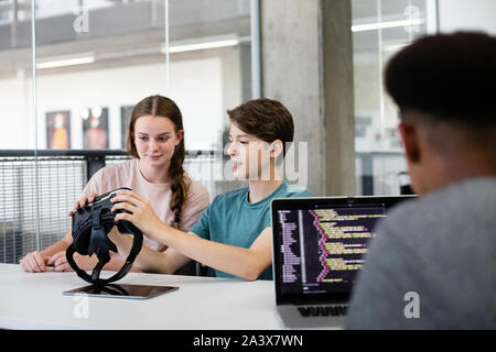 High school students using VR headset in class Stock Photo