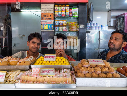 Indian sellers in a sweet shop, Rajasthan, Bikaner, India Stock Photo