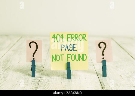 Conceptual hand writing showing 404 Error Page Not Found. Concept meaning Webpage on Server has been Removed or Moved Crumbling sheet with paper clips Stock Photo