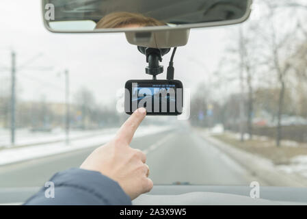 Using dashboard camera to continuously record a view through a vehicle's front windscreen Stock Photo
