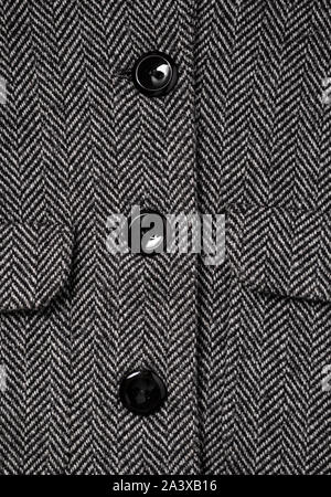 The texture of the fabric for the coat. Closeup of wool herringbone fabric. weed, Wool Background Texture. Stock Photo