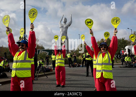 Environmental activist protest about Climate Change during the occupation of City Airport (London's Business Travel hub) in east London, the fourth day of a two-week prolonged worldwide protest by members of Extinction Rebellion, on 10th October 2019, in London, England.