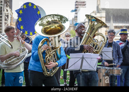 London, UK. 10th Oct, 2019. Trumpeter Alison Balsom performs with a sizeable brass ensemble, conducted by English National Opera conductor Martyn Brabbins and many notable musicians in Parliament Square as 'Brass against Brexit' to protest for continued musicians rights and against Brexit. Credit: Imageplotter/Alamy Live News Stock Photo