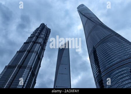 Shanghai, China - April 20, 2019: View of Shanghai Tower (right), the Jin Mao tower (left) and the Shanghai World Financial Center (center). Stock Photo