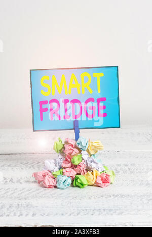 Text sign showing Smart Fridge. Business photo showcasing programmed to sense what kinds of products being stored inside Reminder pile colored crumple Stock Photo