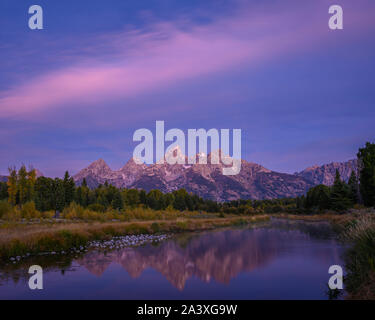 The Teton Mountains at dawn from Lower Schwabacher Landing in Grand Teton National Park, Wyoming, USA.