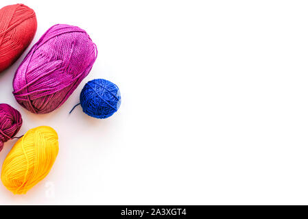 Materials to do the work at home. Multi-colored bandaged threads for needlework. View from above. Flat lay. Copy space. Stock Photo