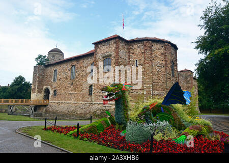 Dragon in the flowerbeds outside Colchester Castle Museum, Colchester, Essex, UK Stock Photo