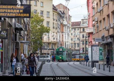 SOFIA, BULGARIA - OCT 10: Pedestrians and trams are passing through the renovated 'Graf Ignatiev' str. in Sofia downtown, 10 October, 2019. Stock Photo