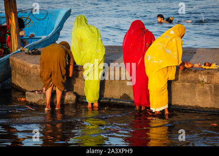 Women doing morning pooja Stock Photo