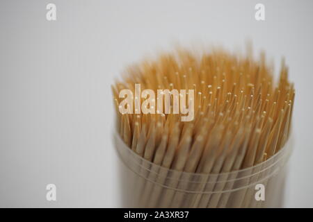 bamboo toothpicks in a round plastic box on the table closeup Stock Photo
