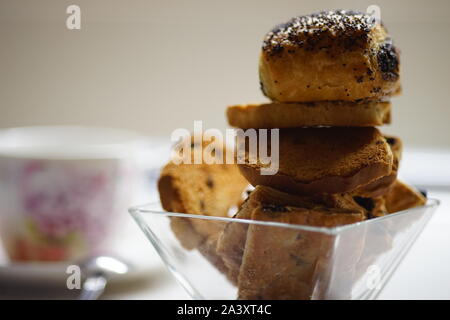 Rolls with poppy seeds. Sweet cookies in glass vase close up. Stock Photo