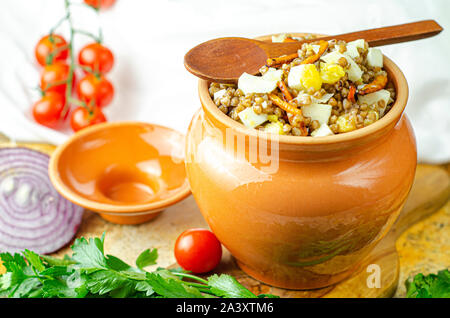 Buckwheat porridge with mushrooms and quail eggs Stock Photo