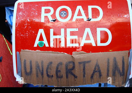 ROAD AHEAD UNCERTAIN  sign displayed by Extinction Rebellion protestors on 8th October 2019 in Westminster, London, UK. Stock Photo