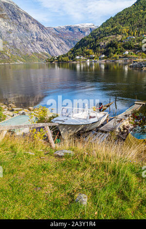 Boats next to the Fjord, Eidfjord, Hordaland, Norway. This pretty village sits at the end of Hardanger Fjord Stock Photo