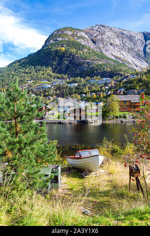 Boats next to the Fjord, Eidfjord, Hordaland, Norway. This pretty village sits at the end of Hardanger Fjord Stock Photo