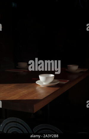 Tea cups on the table- early morning light Stock Photo