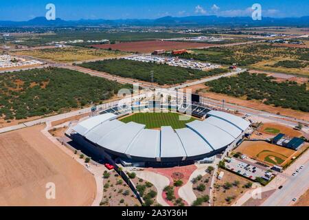 Aerial view, aerial photography of the Yaquis baseball stadium of Ciudad Obregon, of the Mexican Pacific League. LMP . Panoramic of baseball stadium. Drop me, Yaqui Valley. © (© Photo: LuisGutierrez / NortePhoto.com)  pclaves: Baseball picture, Baseball diamond, pitch, Architecture, sports complex, sports architecture, baseball, sports, outdoor, no people, Stadium architecture, stadium facade, Sport architecture, Architectural design, green, green grass, lawn, stands, stadium, Drone, aerial, sky Aerial view of the Sonora stadium and diamond of the playing field, baseball team, Sonora, Mexico, Stock Photo