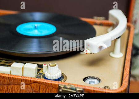 Vinyl record player. Turntable vinyl record player is playing music. Stock Photo