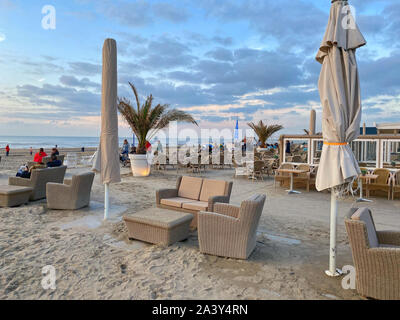 Zandvoort, Netherlands - October 5,2019: Sunset on the beach in Zandvoort. It is a popular beach destination located near to Amsterdam, with clean san Stock Photo