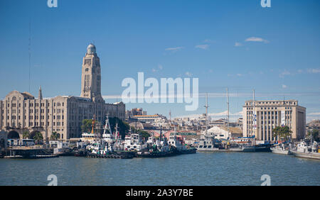 Montevideo, Uruguay - March 09 2013: View of the port of Montevideo from the river, military ships and customs building Stock Photo