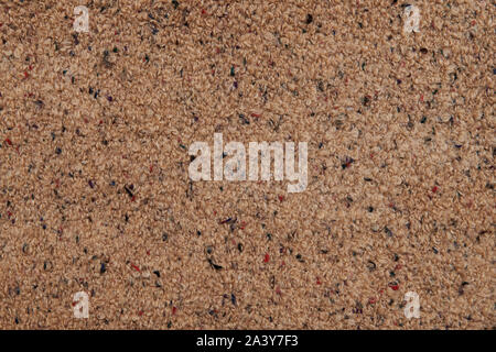 Brown wool texture background. Natural woolen surface with multicolored threads. Backdrop with free space. Coat, carpet, plaid or element of interior. Stock Photo