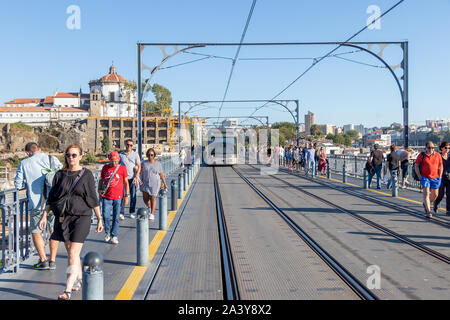 Porto, Portugal, July 19, 2019: View of the metro tram train crossing the Dom Luis I bridge in Porto, Portugal Stock Photo