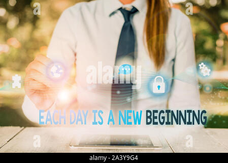 Conceptual hand writing showing Each Day Is A New Beginning. Concept meaning Every morning you can start again Inspiration Female human wear formal wo Stock Photo