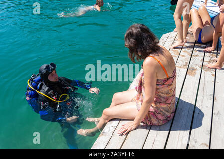 Man scuba diving in lake, Bled Island (Blejski otok), Lake Bled, Bled, Upper Carniola Region, Slovenia Stock Photo