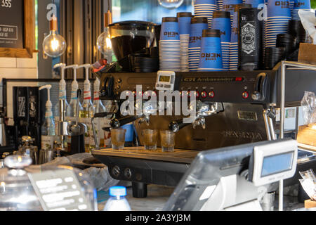 An industrial coffee making machine inside a cafe Nero coffee shop Stock Photo