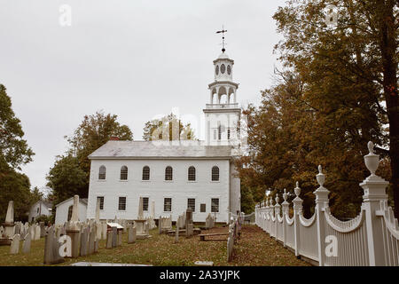 Bennington Centre Cemetery on a cold Fall day with Old First Church in the distance.  Bennington, Vermont Stock Photo