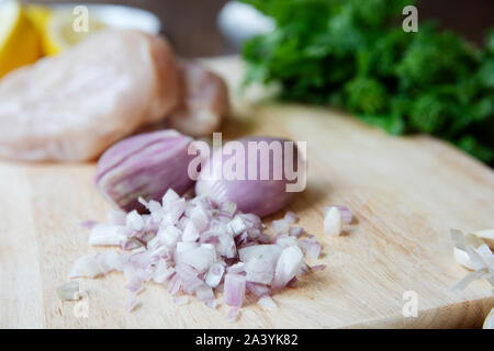 Fresh chopped shallots on a cutting board Stock Photo
