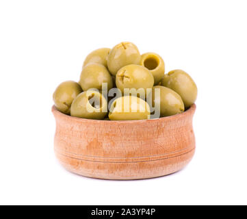 Pitted and marinated green olives in wooden bowl, isolated on white background. Stock Photo