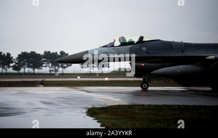 A U.S. Air Force F-16 Fighting Falcon from the 80th Fighter Squadron 'Juvats' taxis down the runway at Kunsan Air Base, Republic of Korea, Oct. 7, 2019. The 80th FS, along with the 35th FS, are the two F-16 squadrons based out of Kunsan tasked with protecting the Republic of Korea air space. (U.S. Air Force photo by Senior Airman Stefan Alvarez) Stock Photo