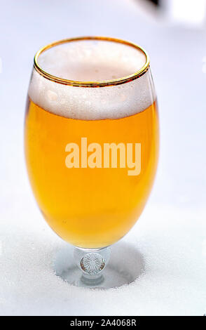 Close up of a cups of Stella Artois full of beer on snow Stock Photo