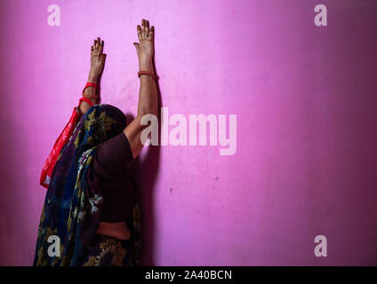 Indian woman praying in Giriraj dharan mandir, Rajasthan, Dausa, India Stock Photo