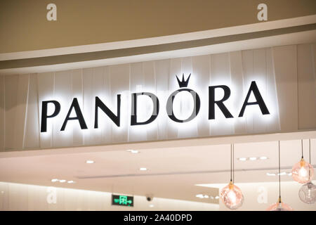 Danish jewelry manufacturer and retailer Pandora store and logo seen in Shenzhen. Stock Photo