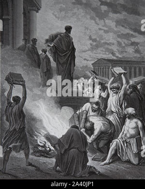 Saint Paul and the burning of pagans books at Ephesus. Acts 19:19. Engraving. Bible Illustration by Gustave Dore. 19th century. Stock Photo